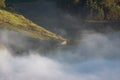 Small travel boat on the lake at morning with fog and relaxing Royalty Free Stock Photo