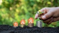 A small tree on top of stacked coins and tax messages. financial taxation ideas Royalty Free Stock Photo