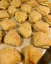 Small triangular cheese cookies, shortbread homemade pastries, cookies sprinkled with sugar