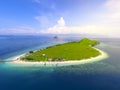 Small tropical island with white green savannah and sandy beach. Beautiful Kenawa island view from above. Nature of the Indonesia