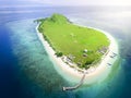 Small tropical island with white green savannah and sandy beach. Beautiful Kenawa island view from above. Nature of the Indonesia