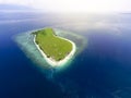 Small tropical island with white green savannah and sandy beach. Beautiful Kenawa island view from above. Nature of the Indonesia