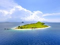 Small tropical island with white green savannah and sandy beach. Beautiful Kenawa island view from above. Nature of the Indonesia