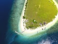 Small tropical island with white green savannah and sandy beach. Beautiful Kenawa island view from above. Nature of the Indonesia