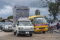 A small truck carries a bunch of mattresses on a busy street of Zanzibar island, Tanzania, East Africa