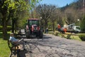 Small truck with garden worker in a lift in park