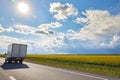 A small truck moves along the road Royalty Free Stock Photo