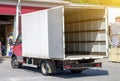 small truck with red cab stands with open empty body ready for loading cargo. ?lipping path is included Royalty Free Stock Photo