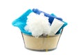 Small tub filled with bath puff, bath foam and towels Royalty Free Stock Photo