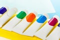 Small tubes of colored gouache laying in a line Royalty Free Stock Photo