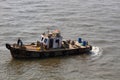 small tug boat swings in waves of Arabian sea