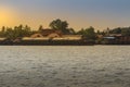 Small tugboat is pulling a large shipping barge up the Chao Phraya River in Bangkok, Thailand. Royalty Free Stock Photo