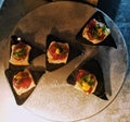 Small tune poke appetizer on Crackers catering Royalty Free Stock Photo