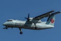 Small turbo prop jet of Air Canada before landing at Pearson International Airport, Toronto Royalty Free Stock Photo