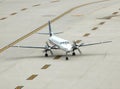 Small turboprop airplane on runway Royalty Free Stock Photo