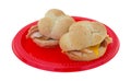 Small turkey sandwiches on red plate Royalty Free Stock Photo