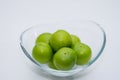 The small turkish green plums in the glass bowl