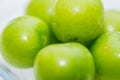 The small turkish green plums on the white background
