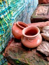 Small two pots made up of soil.