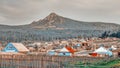 A small Ural village on the background of a high mountain Arvyakryaz