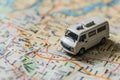 Small van car model on the map paper, concept travel, road trip, Planning the route to fun