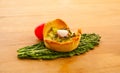 Small vegetable quiche tart on kale leaf