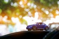 Small vehicle car toy in bokeh green nature Royalty Free Stock Photo