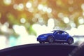 Small vehicle car toy driving travel road trip Royalty Free Stock Photo