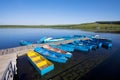 Small vessels arranged together in a lake, in the fall