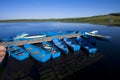 Small vessels arranged together in a lake, in the fall