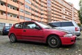 Old classic veteran dented red coupe car Honda Civic parked Royalty Free Stock Photo