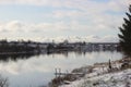 Small village on the banks of a quiet river on a frosty afternoon