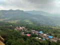 Small village below lohgad fort and view of visapur fort from lohgad fort in background Royalty Free Stock Photo