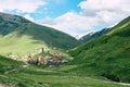 Small traditional village in the Caucasus with stone defense Towers next to a river in a valley. Ushguli in Georgia Royalty Free Stock Photo