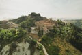 Small village of Chiusure on top of the hill surrounded by Karst cliffs landscape photographed with a drone. Royalty Free Stock Photo