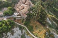 Small village of Chiusure on top of the hill surrounded by Karst cliffs landscape photographed with a drone. Royalty Free Stock Photo