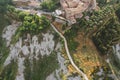 Small village of Chiusure on top of the hill surrounded by Karst cliffs landscape photographed with a drone. Royalty Free Stock Photo