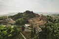 Small village of Chiusure on top of the hill surrounded by Karst cliffs landscape photographed with a drone. Royalty Free Stock Photo