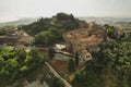 Small village of Chiusure on top of the hill surrounded by Karst cliffs landscape photographed with a drone. Royalty Free Stock Photo