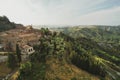 Small village of Chiusure on top of the hill surrounded by Karst cliffs landscape photographed with a drone. Royalty Free Stock Photo