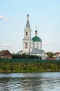 A small village church on a high hill. Church on the banks of the river. Royalty Free Stock Photo
