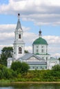 A small village church on a high hill. Church on the banks of the river. Royalty Free Stock Photo