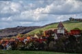 Small village with church in idyllic landscape