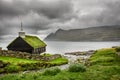 Small village church under heavy clouds Royalty Free Stock Photo