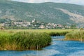 Small village in the distance with the creek and marsh in front Royalty Free Stock Photo