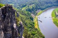 Small village and Elbe river band in front of Bastei sandstone rocks in Saxon Switzerland, Dresden, Germany Royalty Free Stock Photo