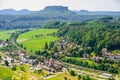 Small village and Elbe river band in front of Bastei sandstone rocks in Saxon Switzerland, Dresden, Germany Royalty Free Stock Photo