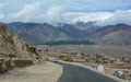 Small village with highway in Leh, India Royalty Free Stock Photo