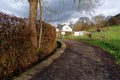 Small village with a little creek, a road and a house - Rural scenery Royalty Free Stock Photo