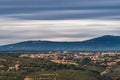 Small village, mountain range and cloudy sky ultra long exposure Royalty Free Stock Photo